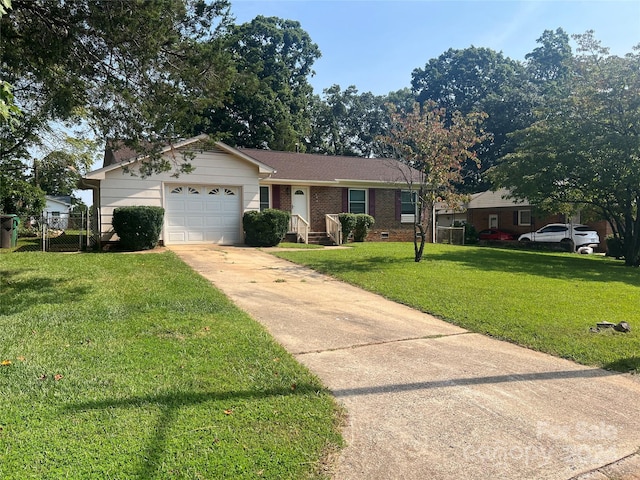 ranch-style home with a front lawn and a garage