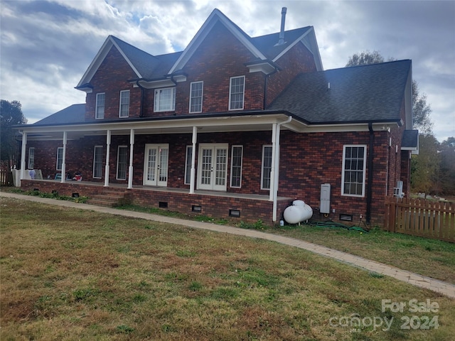 view of front facade with a porch and a front lawn