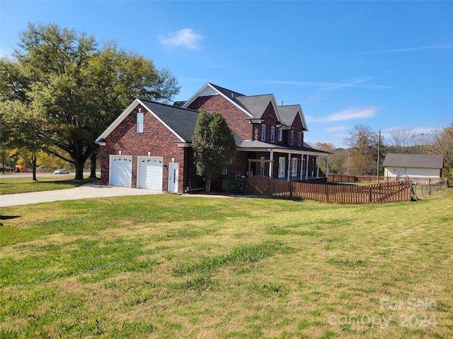 view of front facade featuring a front lawn and a garage