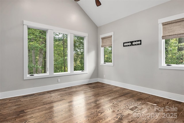 spare room featuring ceiling fan, high vaulted ceiling, and dark hardwood / wood-style floors