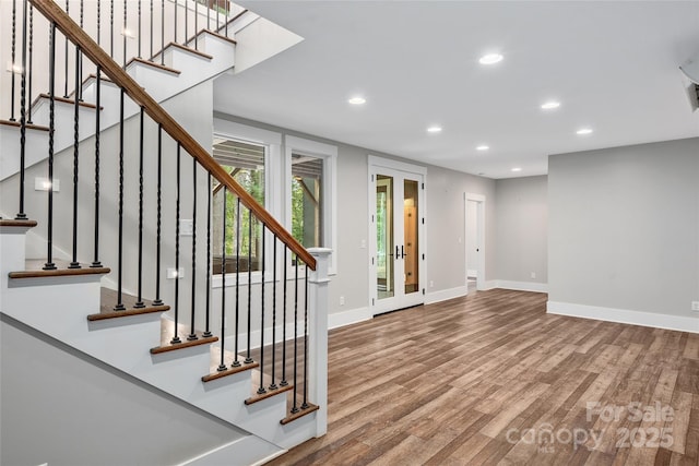 interior space with hardwood / wood-style flooring and french doors