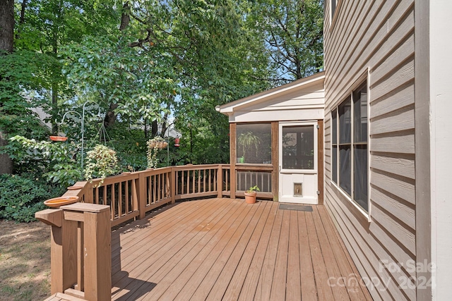 wooden terrace with a sunroom