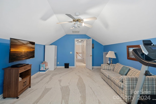 living area with light carpet, vaulted ceiling, and ceiling fan