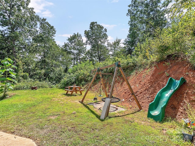 view of playground featuring a lawn