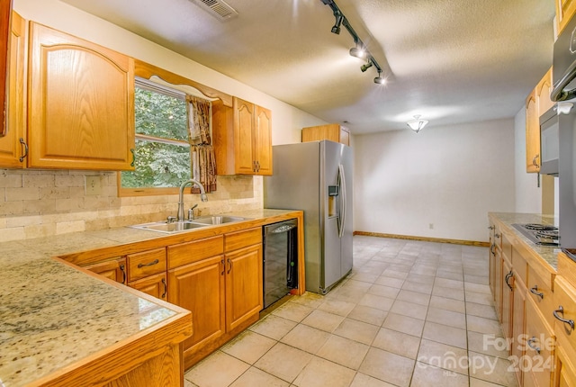 kitchen featuring beverage cooler, light tile patterned floors, sink, decorative backsplash, and track lighting