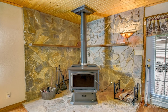 living room featuring a wood stove, wood-type flooring, and wooden ceiling