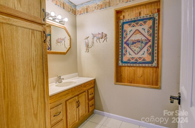 bathroom featuring tile patterned flooring and vanity