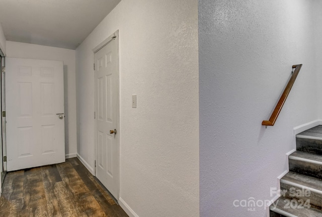 corridor featuring dark wood-type flooring