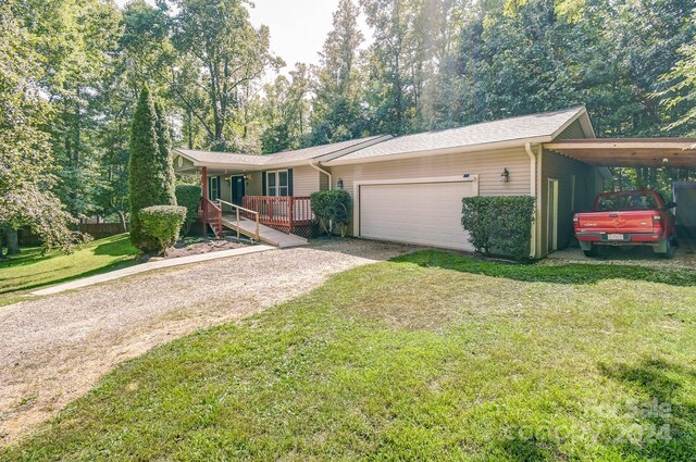 ranch-style house with a front lawn, a carport, and a garage