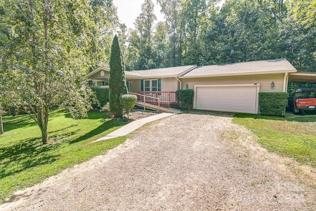 view of front of home featuring a front lawn and a garage