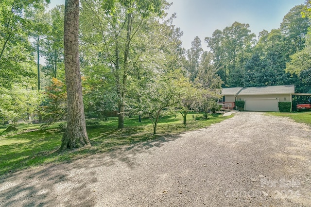 view of front of house with a garage and a front yard