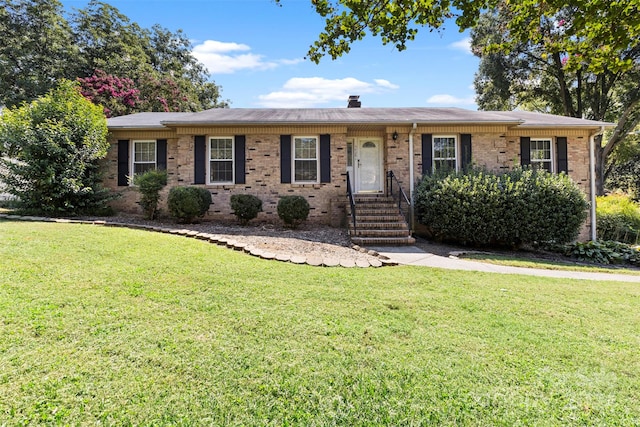 ranch-style home featuring a front yard