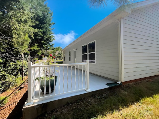 view of side of home with a deck