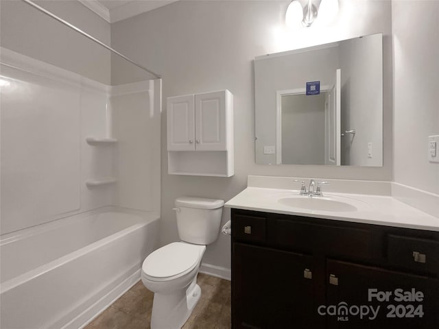 full bathroom featuring tile patterned floors, washtub / shower combination, toilet, and vanity