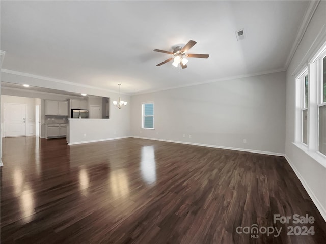 interior space featuring crown molding, ceiling fan with notable chandelier, and dark hardwood / wood-style flooring