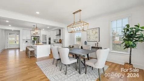 dining space with light hardwood / wood-style floors