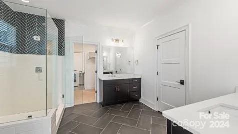 bathroom with vanity and a shower with shower door