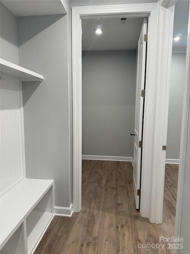 mudroom with dark hardwood / wood-style flooring