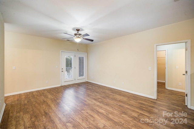 spare room with hardwood / wood-style flooring and ceiling fan