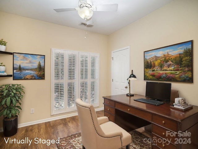 office with dark hardwood / wood-style flooring, ceiling fan, and plenty of natural light