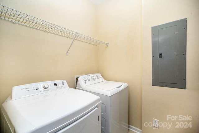 washroom featuring electric panel and washing machine and dryer