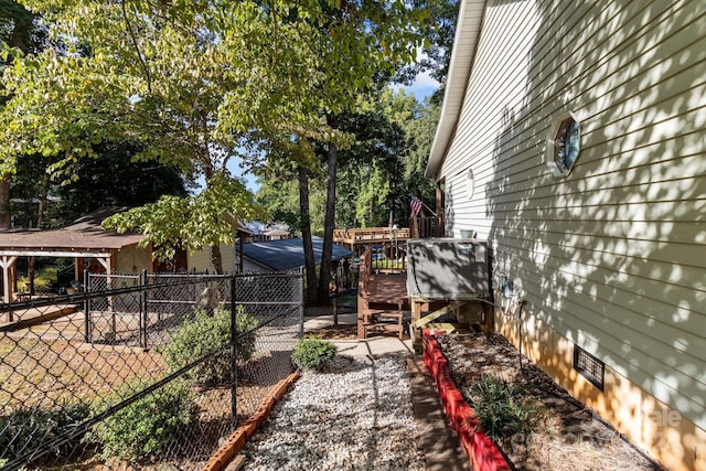 view of yard with a deck and fence