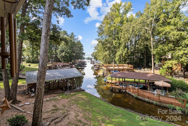 dock area featuring a water view and boat lift