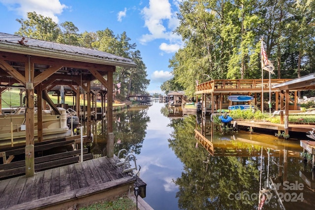 view of dock with a water view and boat lift