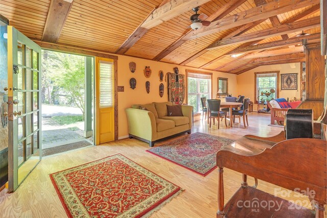 living room with wood ceiling, french doors, ceiling fan, lofted ceiling with beams, and hardwood / wood-style flooring