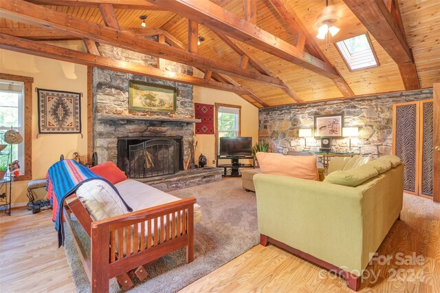 living room with a healthy amount of sunlight, light wood-type flooring, and a fireplace