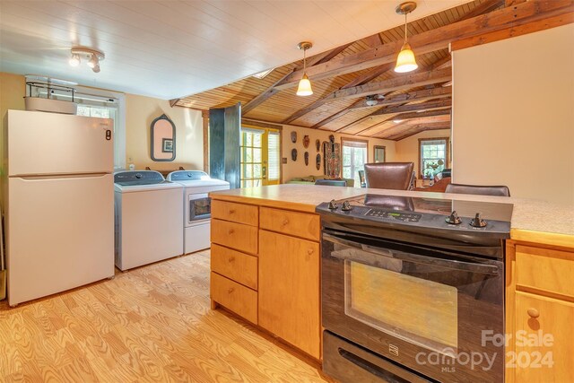 kitchen with light wood-type flooring, washer and dryer, electric range, hanging light fixtures, and white refrigerator