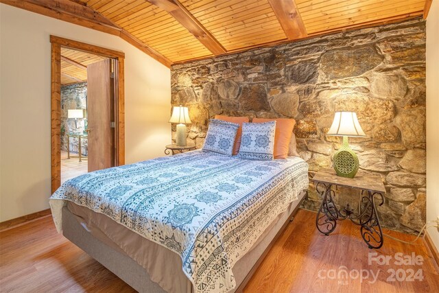 bedroom featuring wood-type flooring, wooden ceiling, and vaulted ceiling