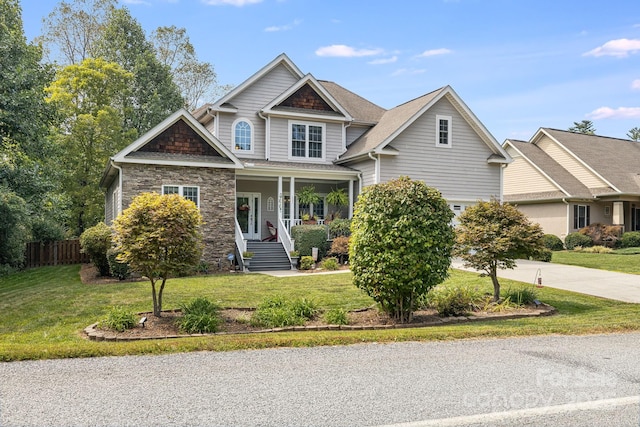 600 Vista Falls Rd, Mills River, NC 28759 - craftsman-style home with driveway, covered porch, and stone siding