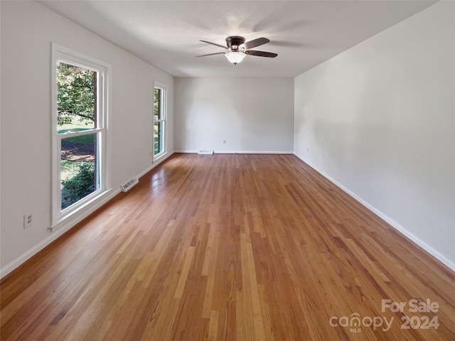 spare room featuring ceiling fan and light hardwood / wood-style floors