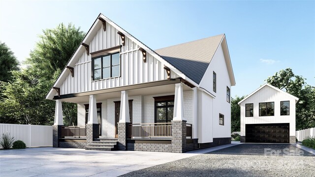 modern farmhouse style home featuring a garage and covered porch