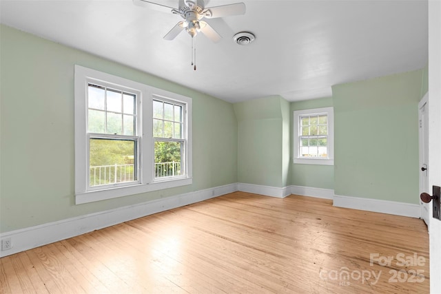 spare room featuring ceiling fan and light hardwood / wood-style floors