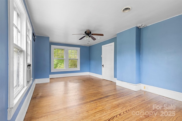 spare room featuring ceiling fan and light wood-type flooring