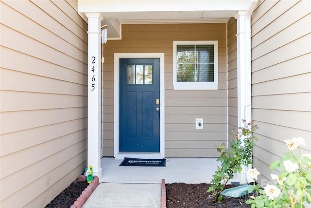 property entrance with covered porch