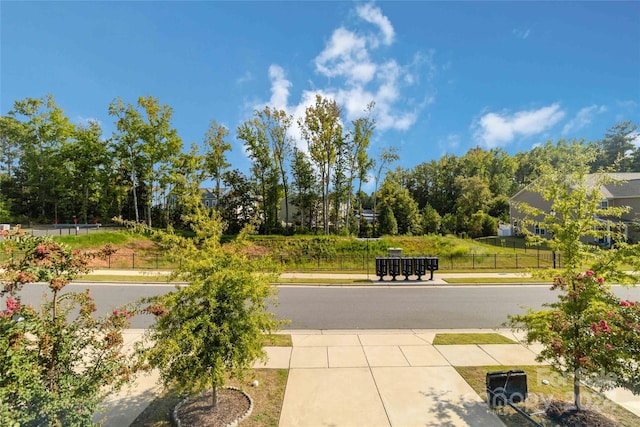 view of property's community with fence