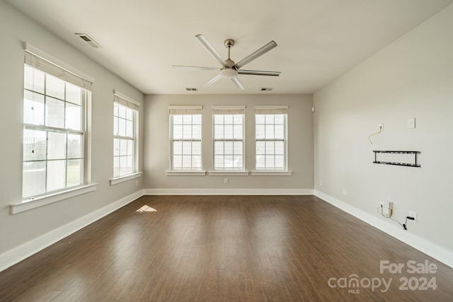 unfurnished room featuring ceiling fan and dark hardwood / wood-style floors