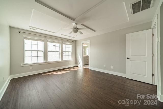 empty room featuring dark wood-type flooring and ceiling fan