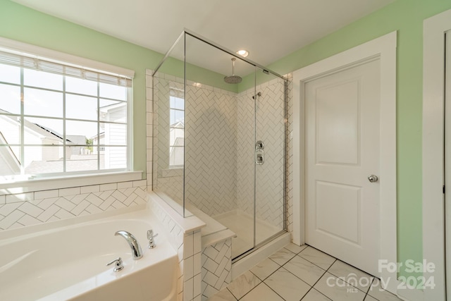 bathroom with shower with separate bathtub