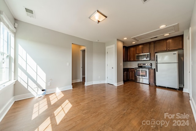 unfurnished living room with light hardwood / wood-style flooring