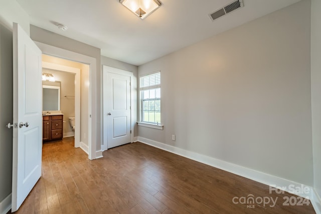 unfurnished bedroom featuring wood-type flooring