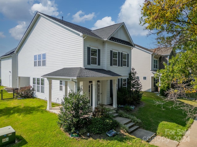 view of front facade with a front yard and a porch