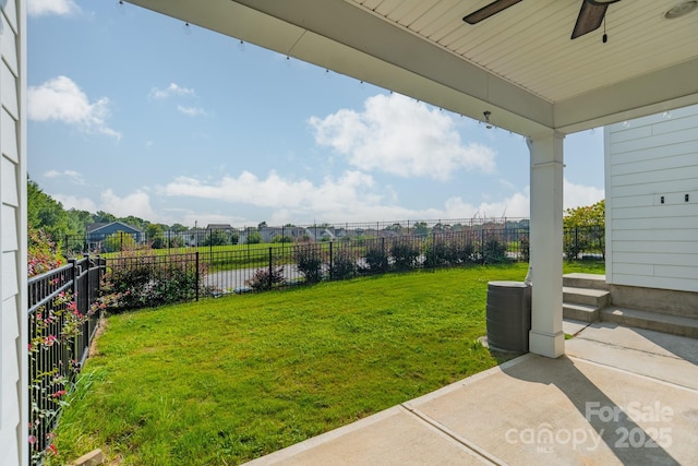 view of yard with a patio area and ceiling fan