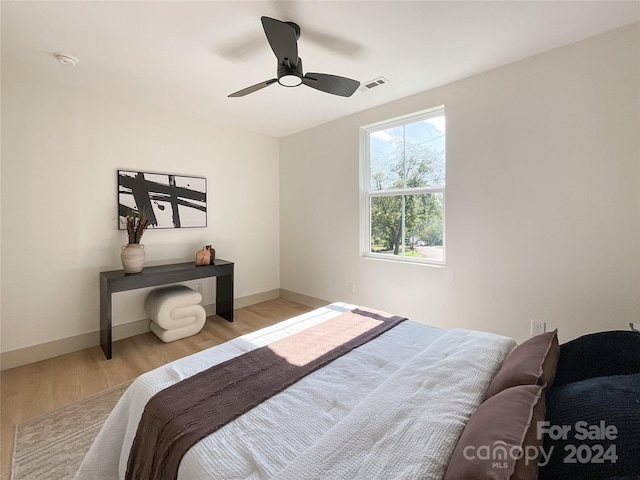 bedroom featuring light hardwood / wood-style floors and ceiling fan