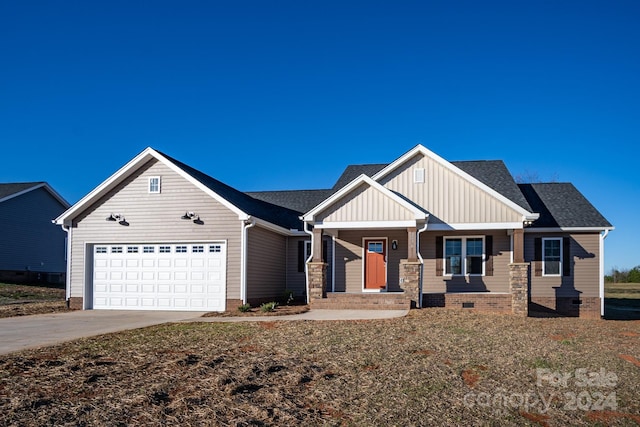 view of front of property featuring a garage and covered porch