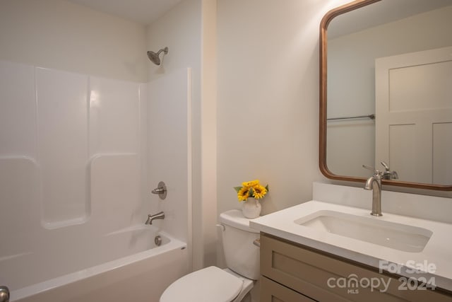 full bathroom featuring shower / washtub combination, vanity, and toilet