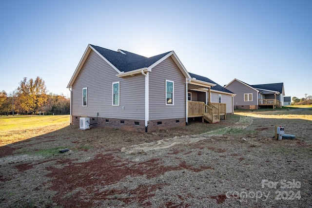 view of home's exterior with central AC unit